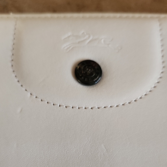 Longchamp Handbags - LONGCHAMP White Leather Wallet with Embossed Logo